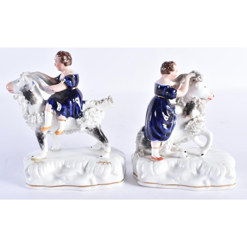 154 - A PAIR OF 19TH CENTURY STAFFORDSHIRE PORCELAIN FIGURES modelled as the Queens children riding goats.... 