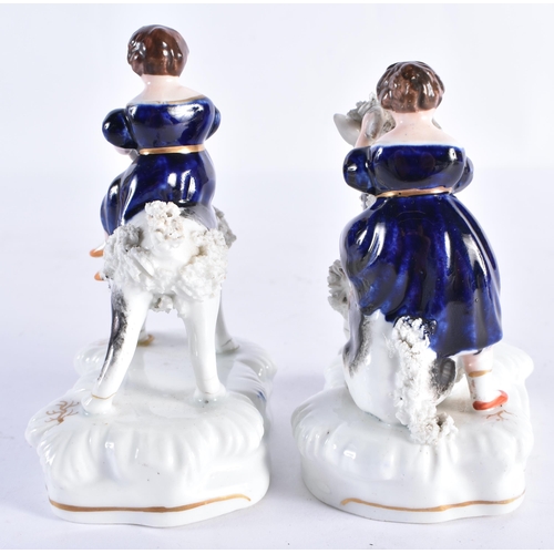 154 - A PAIR OF 19TH CENTURY STAFFORDSHIRE PORCELAIN FIGURES modelled as the Queens children riding goats.... 