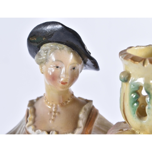 166 - A PAIR OF 18TH CENTURY DERBY PORCELAIN CANDLESTICKS formed as a male and female. 26 cm high.