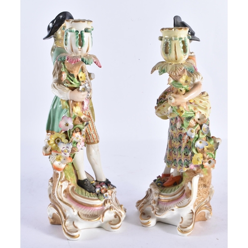 166 - A PAIR OF 18TH CENTURY DERBY PORCELAIN CANDLESTICKS formed as a male and female. 26 cm high.