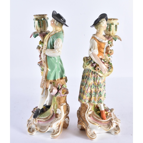 166 - A PAIR OF 18TH CENTURY DERBY PORCELAIN CANDLESTICKS formed as a male and female. 26 cm high.