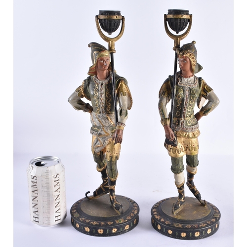 183 - A PAIR OF ANTIQUE COLD PAINTED SPELTER KNIGHT CANDLESTICKS. 37 cm high.