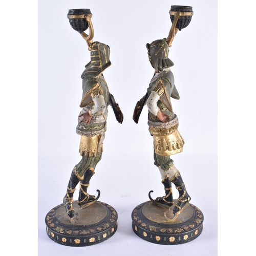 183 - A PAIR OF ANTIQUE COLD PAINTED SPELTER KNIGHT CANDLESTICKS. 37 cm high.