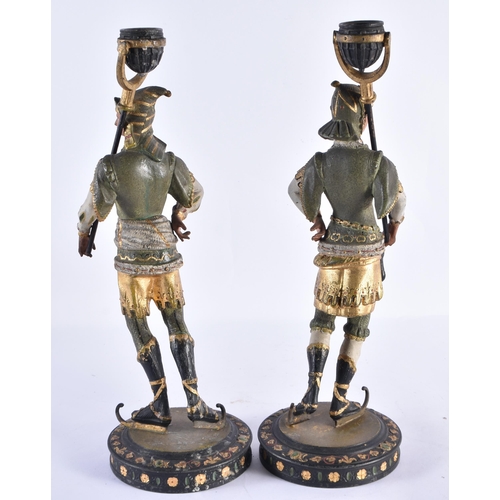 183 - A PAIR OF ANTIQUE COLD PAINTED SPELTER KNIGHT CANDLESTICKS. 37 cm high.