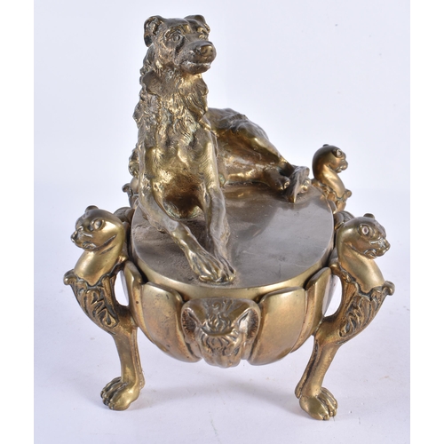 196 - A LARGE 19TH CENTURY BRONZE DESK STAND INKWELL AND COVER mounted with a recumbant hound. 26 cm x 20 ... 