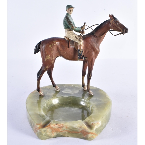 206 - AN EARLY 20TH CENTURY AUSTRIAN COLD PAINTED BRONZE ASHTRAY formed as a jockey on horseback. 19 cm hi... 