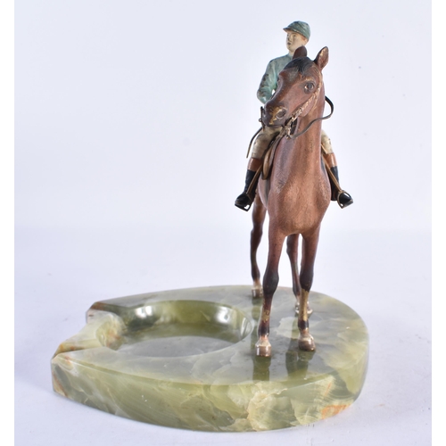 206 - AN EARLY 20TH CENTURY AUSTRIAN COLD PAINTED BRONZE ASHTRAY formed as a jockey on horseback. 19 cm hi... 