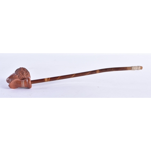 216 - A VINTAGE FRENCH TERRACOTTA NUBIAN PIPE. 22 cm long.