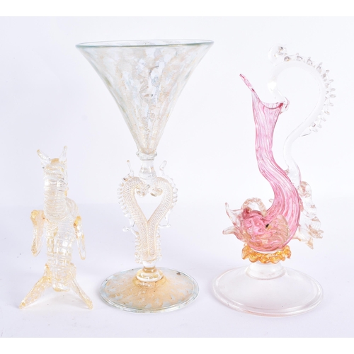 228 - A VENETIAN GLASS FISH EWER together with a similar cup & a seahorse. Largest 17 cm high. (3)