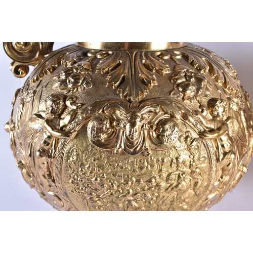 233 - A LARGE PAIR OF 19TH CENTURY FRENCH GILT BRONZE EWERS decorated in relief with classical figures and... 