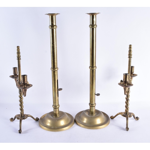 239 - TWO LARGE ANTIQUE BRASS CANDLESTICKS. Largest 48 cm high. (4)