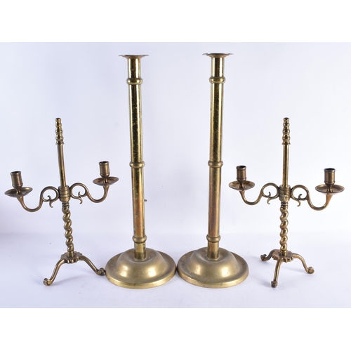 239 - TWO LARGE ANTIQUE BRASS CANDLESTICKS. Largest 48 cm high. (4)