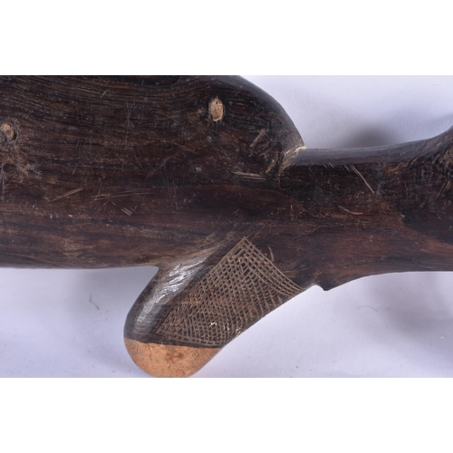 24 - AN UNUSUAL AFRICAN CARVED ZITAN WOOD SCULPTURE OF A GUN. 65 cm long.