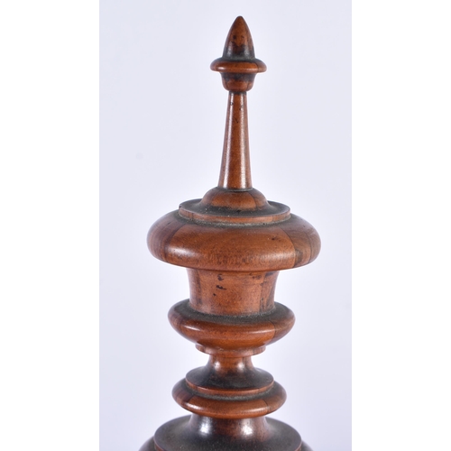 246 - AN ANTIQUE TREEN EGG CUP HOLDER together with a treen carved wood liquor set. Largest 40 cm high. (2... 