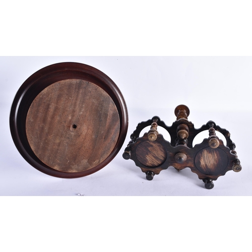 246 - AN ANTIQUE TREEN EGG CUP HOLDER together with a treen carved wood liquor set. Largest 40 cm high. (2... 