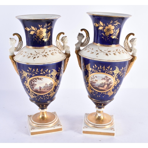 257 - A PAIR OF EARLY 19TH CENTURY ENGLISH PORCELAIN VASES painted with interior scenes. 31.5 cm high.