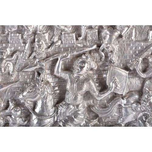 25D - A RARE LARGE 19TH CENTURY INDIAN BURMESE SILVER REPOUSSE PLAQUE decorated with numerous figures in v... 