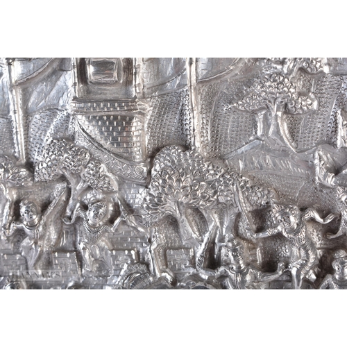 25D - A RARE LARGE 19TH CENTURY INDIAN BURMESE SILVER REPOUSSE PLAQUE decorated with numerous figures in v... 