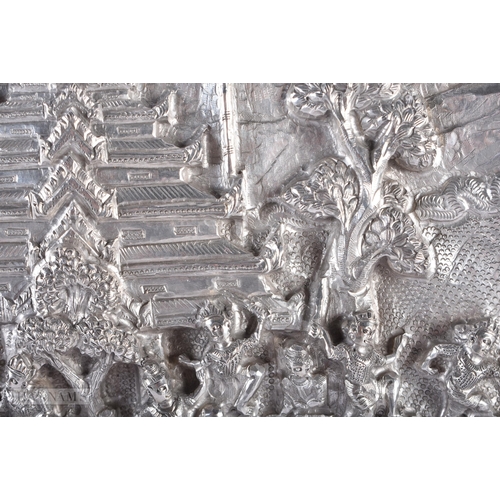 25D - A RARE LARGE 19TH CENTURY INDIAN BURMESE SILVER REPOUSSE PLAQUE decorated with numerous figures in v... 