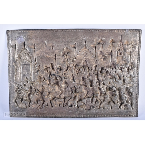 25D - A RARE LARGE 19TH CENTURY INDIAN BURMESE SILVER REPOUSSE PLAQUE decorated with numerous figures in v... 