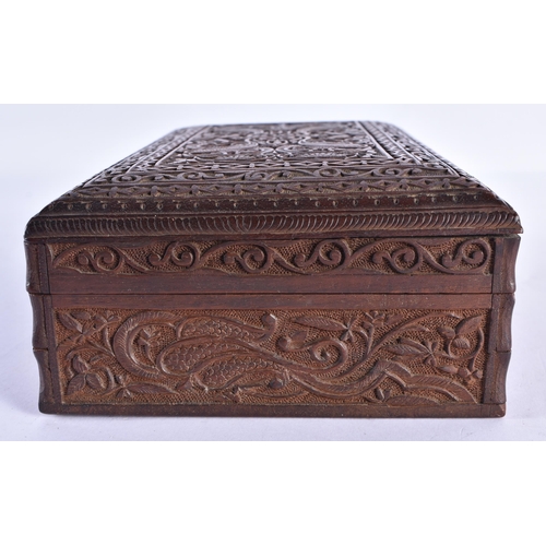 26 - A 19TH CENTURY ANGLO INDIAN CARVED SANDALWOOD BOX AND COVER decorated with foliage. 21 cm x 14 cm.