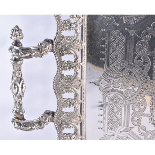 261 - A LARGE 19TH CENTURY SILVER PLATED SERVING TRAY engraved with motifs. 68 cm x 44 cm.