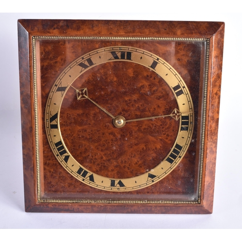 262 - AN ART DECO WALNUT CLOCK together with a gypsy wagon within a bottle. Largest 32 cm high. (2)