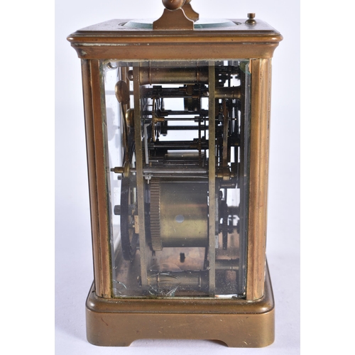 297 - AN ANTIQUE FRENCH BRASS CARRIAGE CLOCK. 17 cm high inc handle.