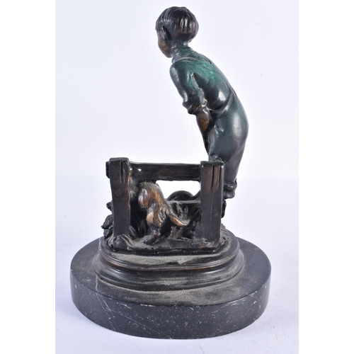 299 - A CONTEMPORARY COLD PAINTED BRONZE FIGURE OF A BOY modelled with puppies. 24 cm high.