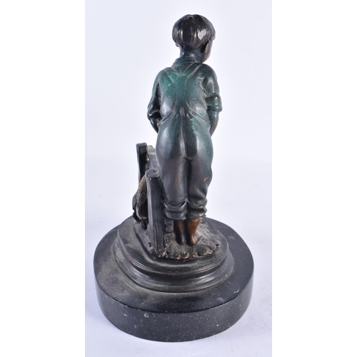 299 - A CONTEMPORARY COLD PAINTED BRONZE FIGURE OF A BOY modelled with puppies. 24 cm high.