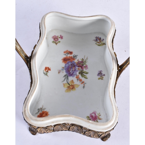 301 - AN EARLY 20TH CENTURY CONTINENTAL PORCELAIN BOX AND COVER with gilt mounts. 21 cm x 30 cm inc handle... 