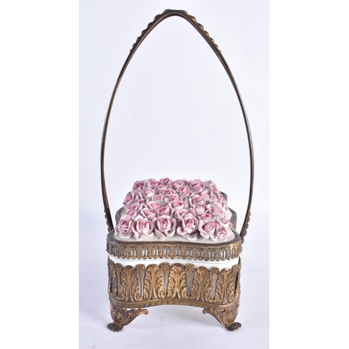 301 - AN EARLY 20TH CENTURY CONTINENTAL PORCELAIN BOX AND COVER with gilt mounts. 21 cm x 30 cm inc handle... 