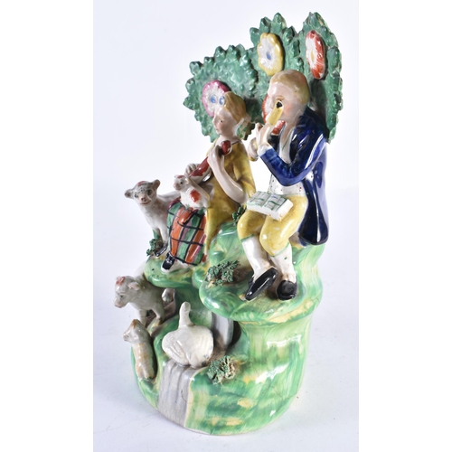 305 - A 19TH CENTURY STAFFORDSHIRE GROUP OF MUSICIANS modelled beside animals. 23 cm x 12 cm.