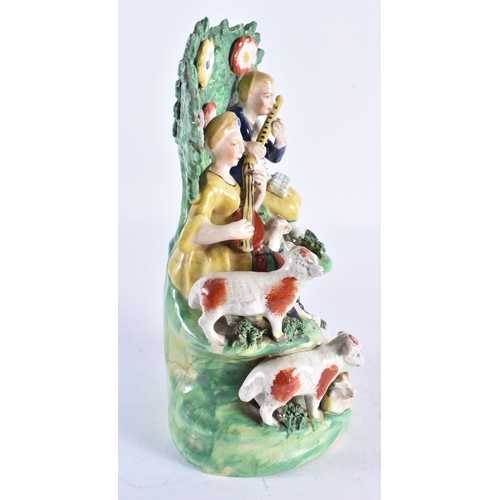 305 - A 19TH CENTURY STAFFORDSHIRE GROUP OF MUSICIANS modelled beside animals. 23 cm x 12 cm.