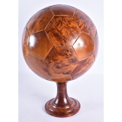 308 - A LOVELY TREEN CARVED WOOD FOOTBALL ON STAND. 34 cm x 20 cm.