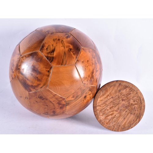 308 - A LOVELY TREEN CARVED WOOD FOOTBALL ON STAND. 34 cm x 20 cm.