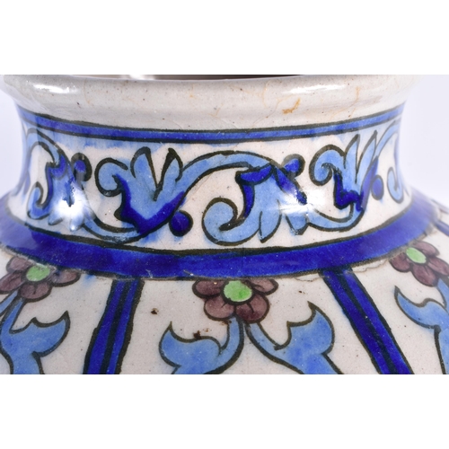 315 - A LARGE MIDDLE EASTERN PERSIAN IZNIK POTTERY VASE painted with stylised flowers. 38 cm x 20 cm.