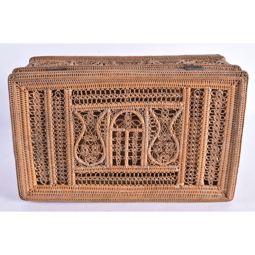 319 - A CHARMING EARLY 20TH CENTURY WICKER CASKET with divided interior. 32 cm x 18 cm x 16 cm.