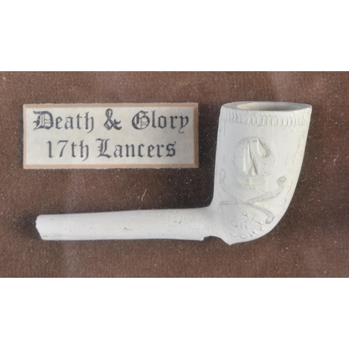 322 - A UNUSUAL ANTIQUE CLAY PIPE DISPLAY. 38 cm x 28 cm.