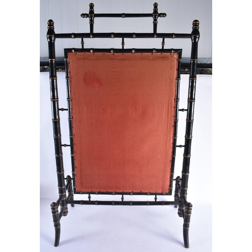 327 - AN AESTHETIC MOVEMENT EBONISED CARVED WOOD FIRE SCREEN inset with an embroidered panel of flowers. 1... 