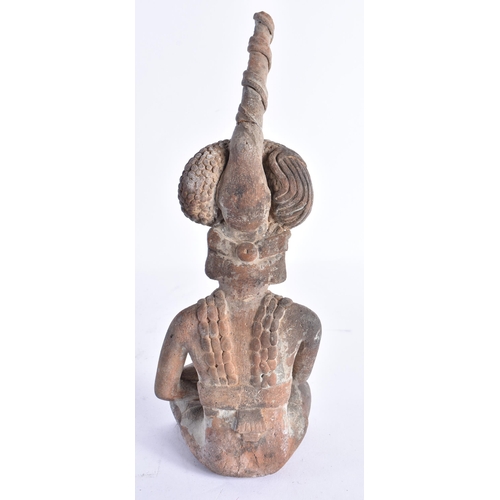 328 - AN UNUSUAL SOUTH AMERICAN TRIBAL POTTERY FIGURE OF A MALE modelled with arms crossed. 22 cm high.