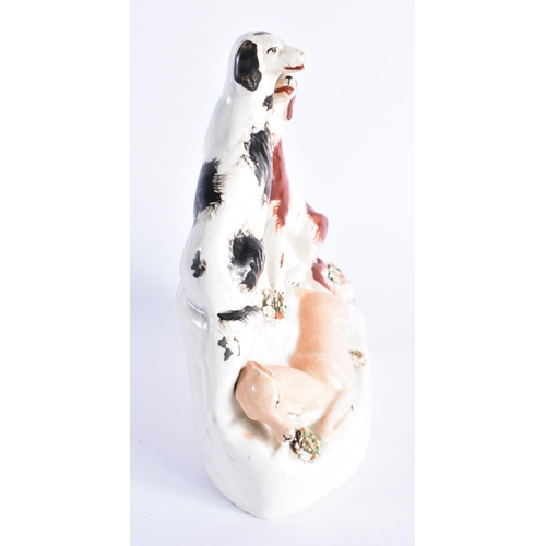 344 - AN UNUSUAL 19TH CENTURY STAFFORDSHIRE FIGURE OF SPANIELS modelled standing over a deer. 18 cm x 14 c... 