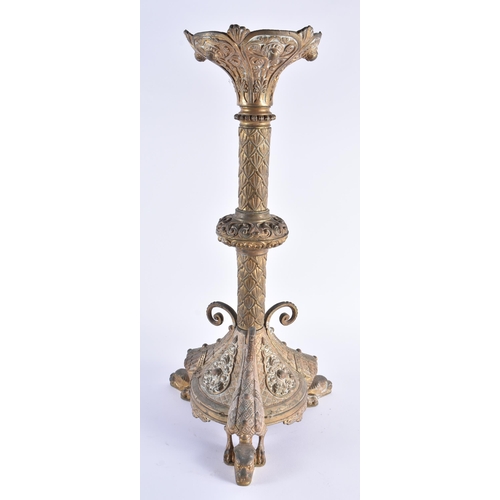 345 - A LARGE 19TH CENTURY CONTINENTAL BRONZE CANDLESTICK decorated with motifs, the feet formed as winged... 