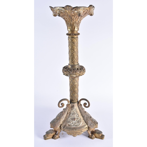 345 - A LARGE 19TH CENTURY CONTINENTAL BRONZE CANDLESTICK decorated with motifs, the feet formed as winged... 