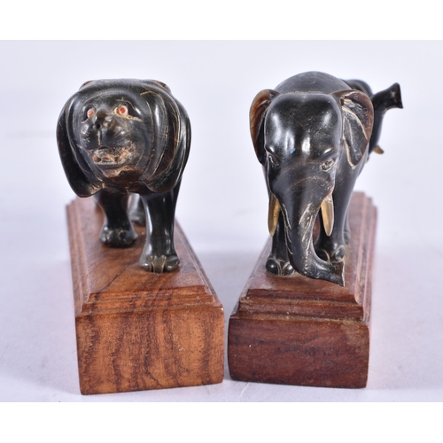 357 - TWO 19TH CENTURY ANGLO INDIAN CARVED RHINOCEROS HORN FIGURES. Largest 11 cm wide. (2)