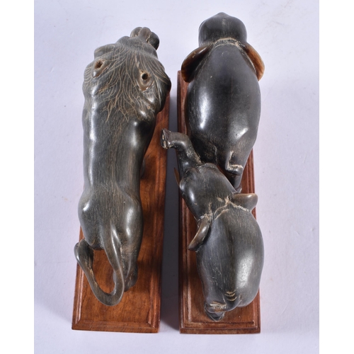 357 - TWO 19TH CENTURY ANGLO INDIAN CARVED RHINOCEROS HORN FIGURES. Largest 11 cm wide. (2)