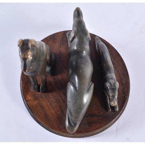 358 - A RARE 19TH CENTURY ANGLO INDIAN CARVED RHINOCEROS HORN DOG GROUP. 12 cm x 12 cm.