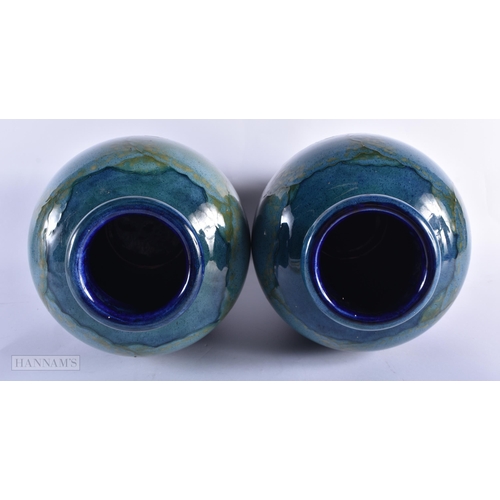 35B - A FINE AND RARE PAIR OF MOORCROFT MOONLIT BLUE VASES C1930 of unusually large scale. 32 x 22 cm  (2)