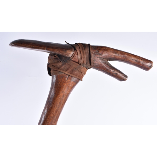 365 - A PAIR OF TRIBAL CARVED WOOD AXE TYPE WEAPONS. 60 cm long. (2)