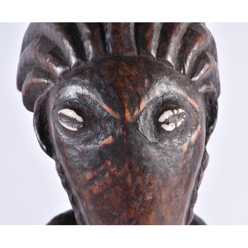 373 - AN UNUSUAL AFRICAN TRIBAL CARVED WOOD FIGURE inlaid with shell eyes. 44 cm high.